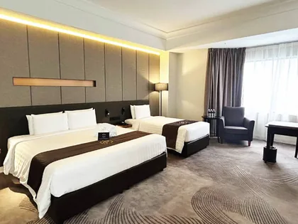 Completed hotel twin room, upholstered headboard and desk