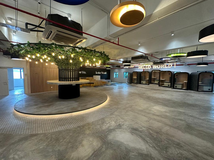 Completed commercial collaboration space with integrated pods and feature lighting