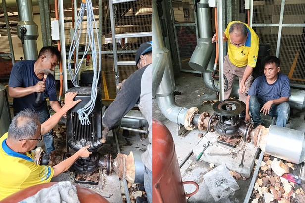 Maintenance team servicing a commercial water pump assembly